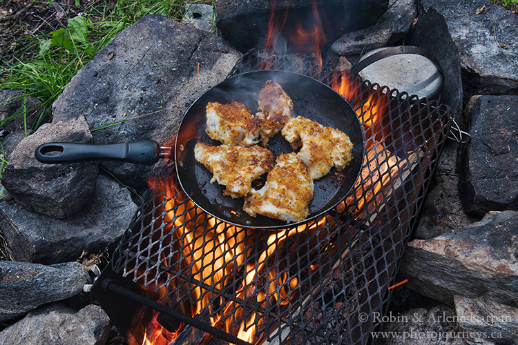 Walleye in frying pan over fire