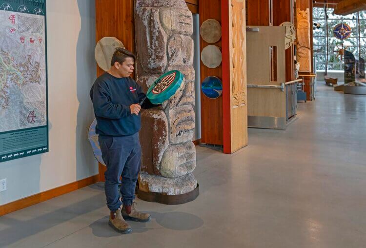 Traditional drummer playing a welcome song. Lil'wat Cultural Centre, Whistler, BC.