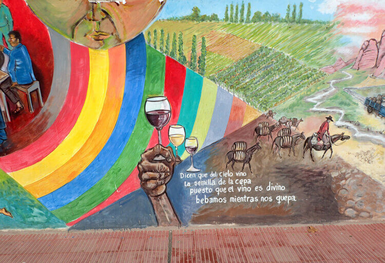 Mural to the divine nature of wine on a Cafayate street., ARgentina