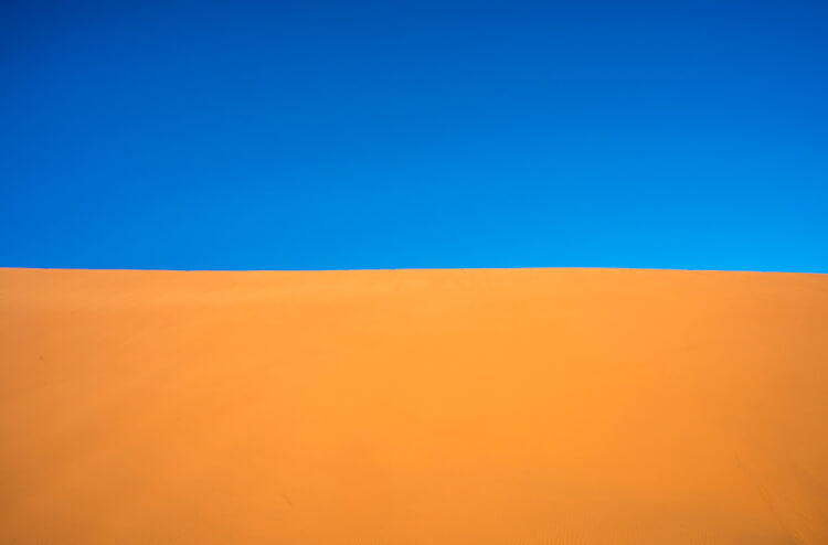 Abstract photography with a sand dune against the sky, Namibia.