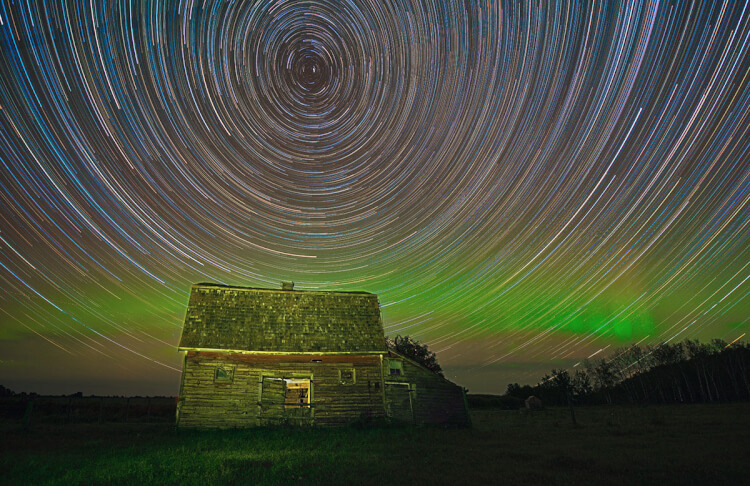 Old barn, aurora, and star trail, Saskatchewan