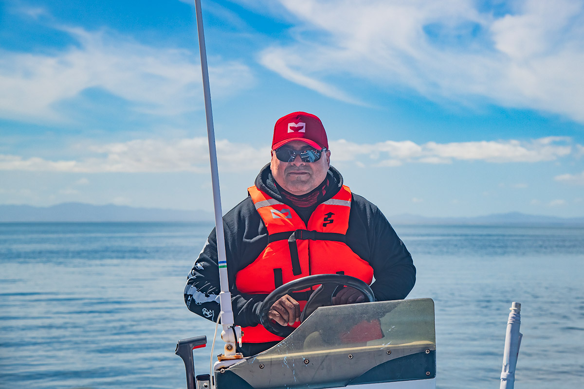 Boat driver from Mario's Tours taking us to watch gray whales, Baja California Sur, Mexico.