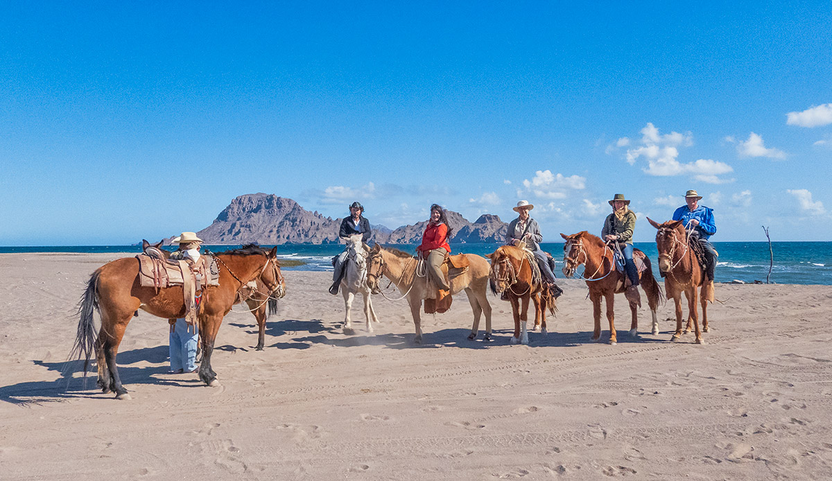 Horseback riding on beach near Loreto, Mexico.
