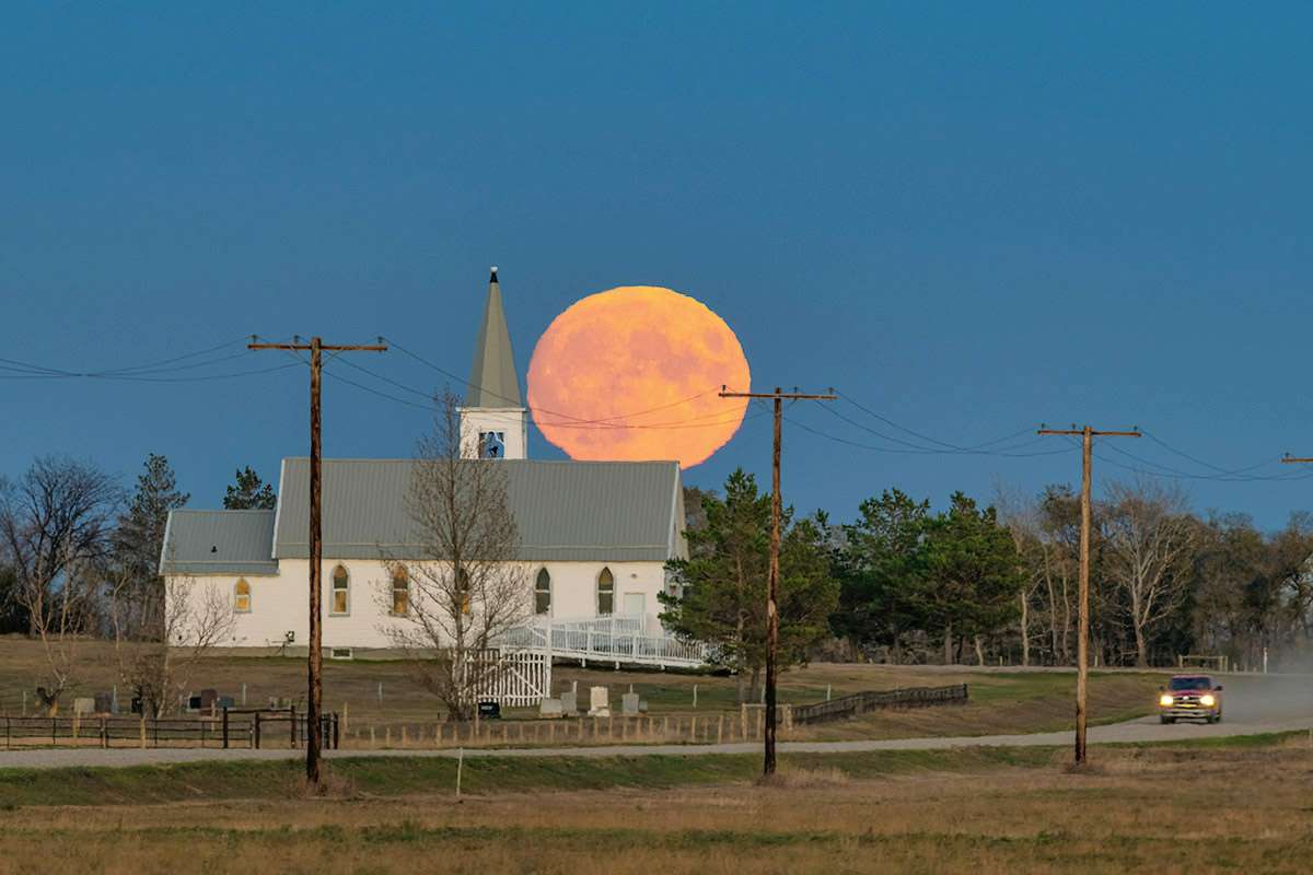 Moonrise over country church, Saskatchewan.